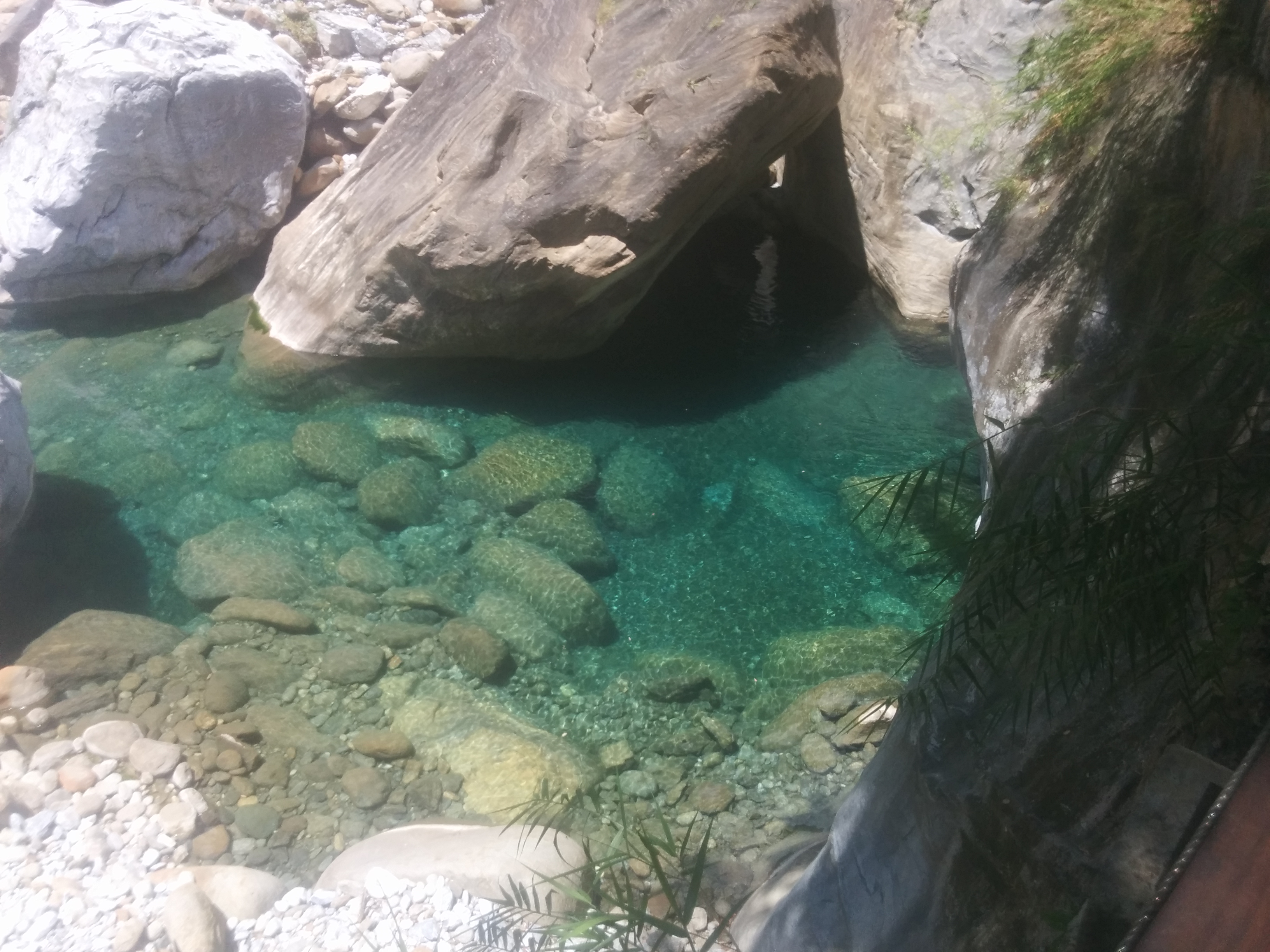 Shakadang's river water is bright blue and extremely clear