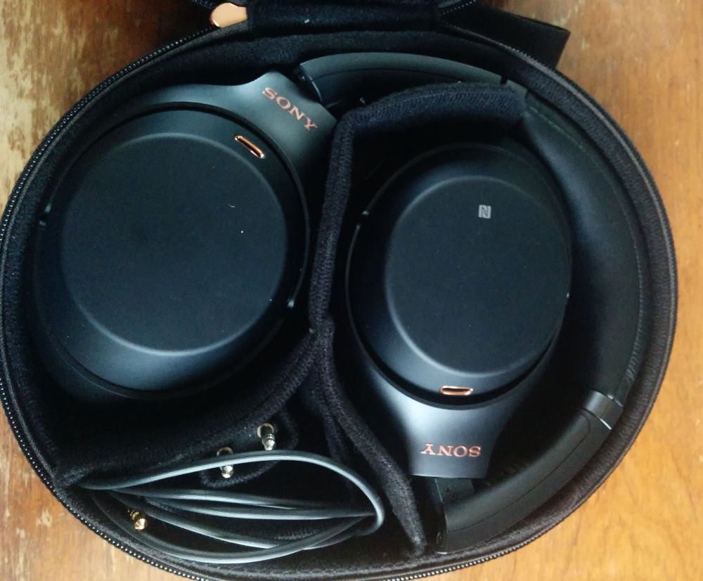 The Sony WH-1000X M3 folded in their case