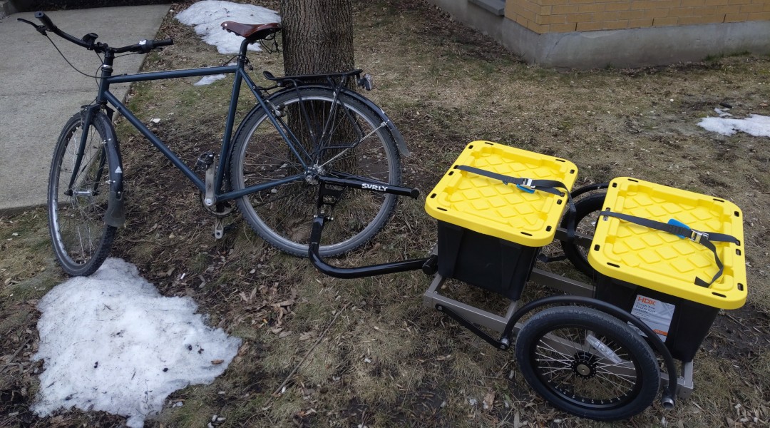 The trailer, attached to my bike, hauling two storage crates