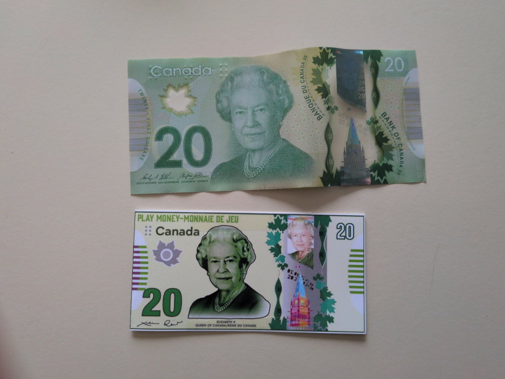 A real Canadian 20$ bill, side-to-side with the play money version
